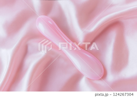 Vibrator on pink background, top view 124267304
