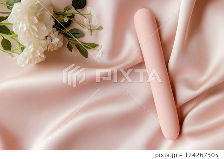 Vibrator on pink background, top view 124267305
