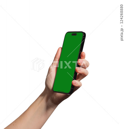Hand holding a smartphone with a blank green chromakey screen, tilted for a dynamic perspective. Hand holding a smartphone with a blank green chromakey screen, tilted for a dynamic perspective. 124268880
