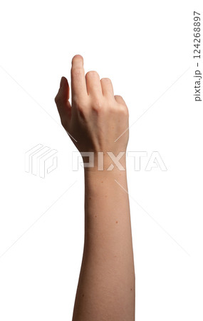 Female hand with index finger slightly bent, making a clicking or pressing gesture. Thumb positioned 124268897