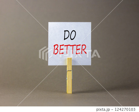 Do better symbol. Concept words Do better on beautiful white paper on wooden clothespin. Beautiful grey background. Business and do better concept. Copy space. Do better symbol. Concept words Do better on beautiful white paper on wooden clothespin. Beautiful grey background. Business and do better concept. Copy space. 124270103