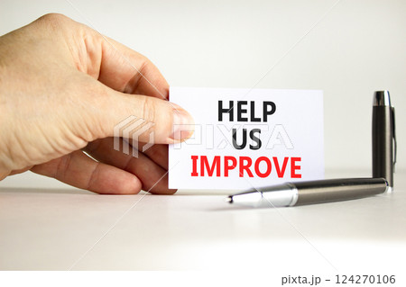 Help us improve symbol. Concept words Help us improve on beautiful white card. Beautiful white background. Businessman hand. Business motivational help us improve concept. Copy space. Help us improve symbol. Concept words Help us improve on beautiful white card. Beautiful white background. Businessman hand. Business motivational help us improve concept. Copy space. 124270106