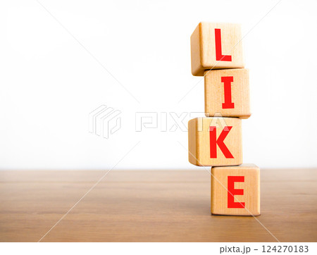 Like symbol. Concept word Like on beautiful wooden blocks. Beautiful wooden table white background. Business, lifestyle, support and like concept. Copy space. Like symbol. Concept word Like on beautiful wooden blocks. Beautiful wooden table white background. Business, lifestyle, support and like concept. Copy space. 124270183