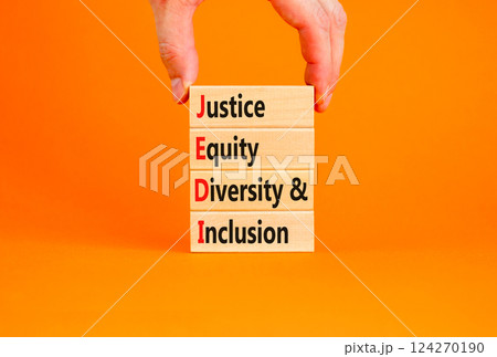 Justice equity diversity inclusion symbol. Concept words JEDI Justice Equity Diversity Inclusion on blocks. Beautiful orange background. Business justice equity diversity inclusion concept. Copy space 124270190