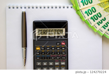 Perfection symbol. Concept word Perfection on beautiful black calculator. Beautiful white background. Euro bills. Black pen. Business perfection concept. Copy space. Perfection symbol. Concept word Perfection on beautiful black calculator. Beautiful white background. Euro bills. Black pen. Business perfection concept. Copy space. 124270224