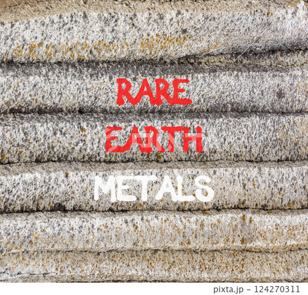 Rare earth metals symbol. Concept words Rare earth metals on beautiful grey stone wall. Beautiful grey mountain stone wall background. Business and rare earth metals concept. Copy space. Rare earth metals symbol. Concept words Rare earth metals on beautiful grey stone wall. Beautiful grey mountain stone wall background. Business and rare earth metals concept. Copy space. 124270311