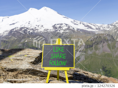 Like share follow symbol. Concept words Like Share Follow on beautiful black yellow blackboard. Beautiful mountain Elbrus background. Business like share follow concept. Copy space. Like share follow symbol. Concept words Like Share Follow on beautiful black yellow blackboard. Beautiful mountain Elbrus background. Business like share follow concept. Copy space. 124270326