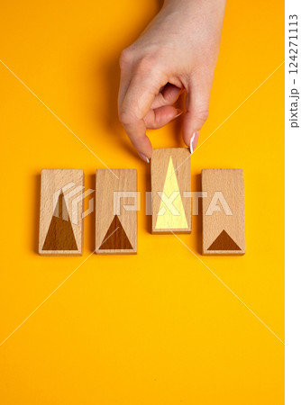 The hand selects outstanding growth indicators. Business success, financial achievement, and outstanding performance metrics. The hand selects outstanding growth indicators. Business success, financial achievement, and outstanding performance metrics. 124271113
