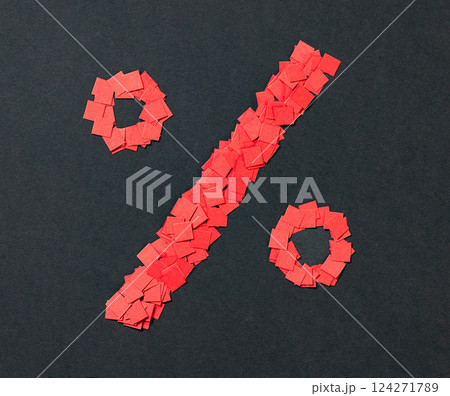 percent sign made from small pieces of red colored applique paper squares 124271789
