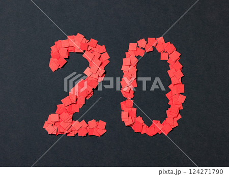 number twenty sign made from small pieces of red colored applique paper squares 124271790