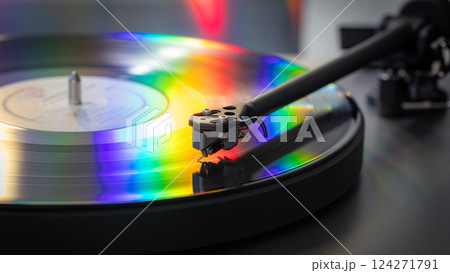 vinyl record with colorful lights reflection 124271791