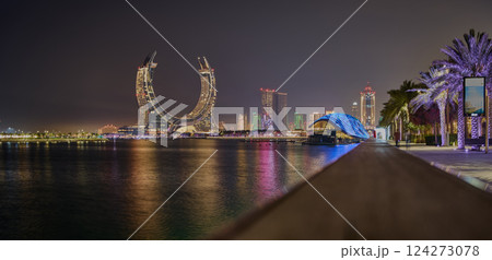 Katara Hospitality Tower or Lusail Katara Hotel North Tower in Lusail , Qatar  at night showing the unique architecture of the illuminated tower 124273078