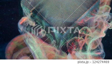 Shimmering liquid. Gloss wave. Transparent paint neon color veil falling from glass cube. Floating luxurious pearl dye blur abstract water black background. 124274469