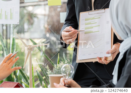 Data Analysis and Eco Sustainability. A professional presents a sustainability report in a corporate meeting. Data Analysis and Eco Sustainability. A professional presents a sustainability report in a corporate meeting. 124274640