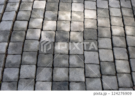 Gray concrete pavers, ideal for walkways, patios, or driveways. Gray concrete pavers, ideal for walkways, patios, or driveways. 124276909