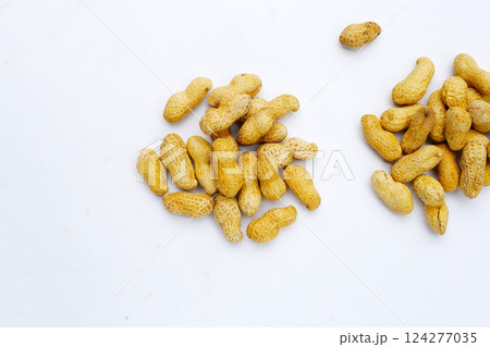 Roasted peanuts in shell on white background. 124277035