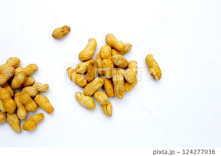 Roasted peanuts in shell on white background. 124277036