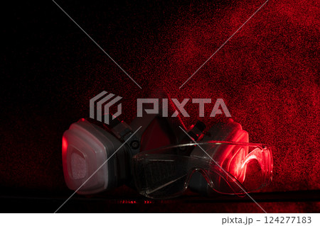 In rain spray of toxic chemicals, mask is essential object for health safety. Combined with protective glasses, industrial gas mask offers vital protection against gas, smoke, dust, and pollution 124277183