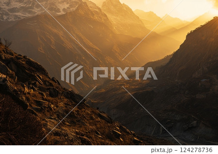 Sunset Over Rolling Hills and Rocky Terrain 124278736