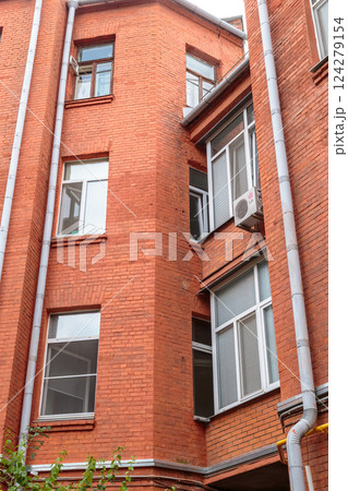 The facade of the old red brick building that was The facade of the old red brick building that was 124279154