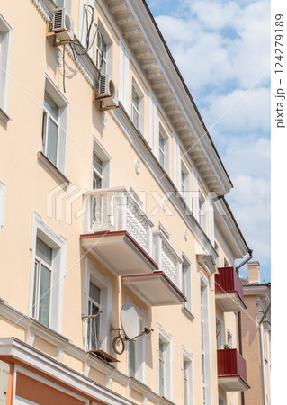 The facade of a modern building in which people 124279189