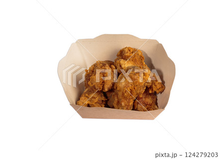 Fried chicken wings in batter in a package on a 124279203