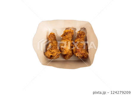 Fried chicken wings in batter in a package on a 124279209