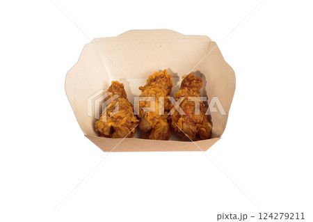 Fried chicken wings in batter in a package on a Fried chicken wings in batter in a package on a 124279211