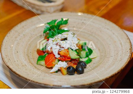 A beautiful salad of fresh vegetables with sour A beautiful salad of fresh vegetables with sour 124279968