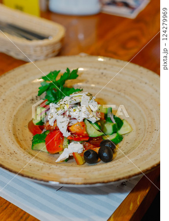 A beautiful salad of fresh vegetables with sour A beautiful salad of fresh vegetables with sour 124279969