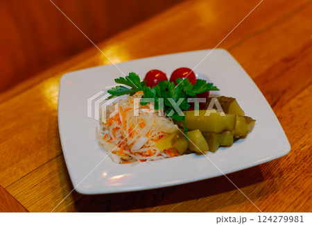 Pickled cabbage cucumbers tomatoes on one white 124279981