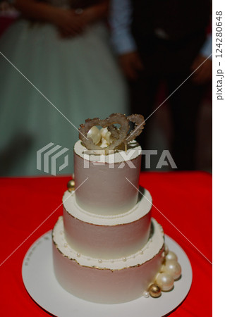 A beautiful handmade wedding cake you stands on a 124280648