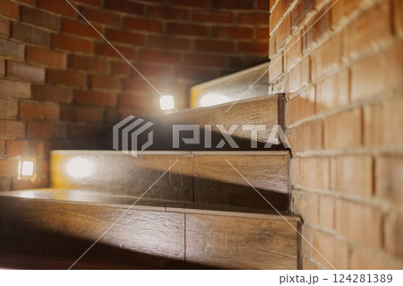 A beautiful wooden staircase with illuminated A beautiful wooden staircase with illuminated 124281389