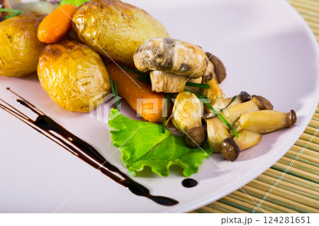 Baked honey funguses, champignons with potatoes, caramelized shallot, balsamic Baked honey funguses, champignons with potatoes, caramelized shallot, balsamic 124281651