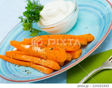 Carrot sticks with sour cream 124281683