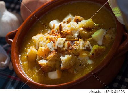Vegetable soup with croutons and cheese 124281698