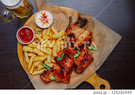 Appetizing fried wings with french fries sauce and 124282049