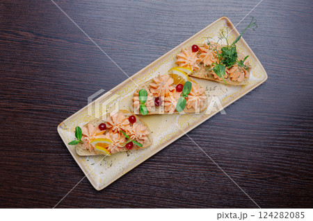 White bread sandwiches with fish cream and herbs 124282085