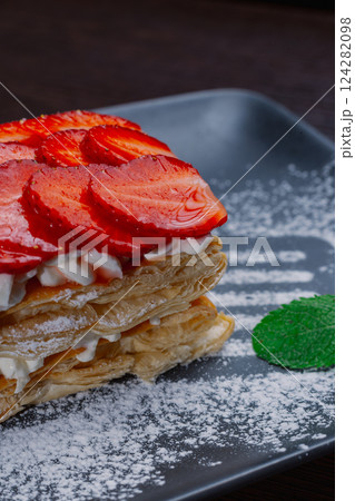 Appetizing dessert of strawberries and puff pastry 124282098