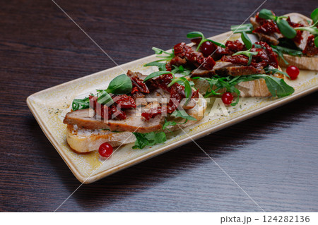 Appetizing sandwiches with meat, greens and Appetizing sandwiches with meat, greens and 124282136