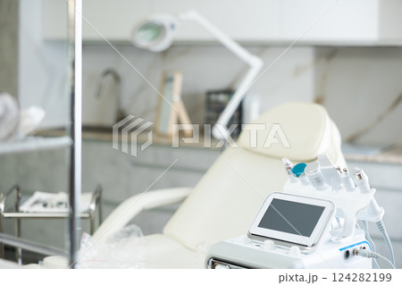 Aesthetic medicine clinic office with a treatment chair and a hydrogen-oxygen cosmetology apparatus 124282199