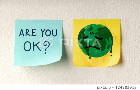World Earth Day Concept. a Message on Sticky Note represent Caring and Encouraging the Tired Green Globe. 124282918