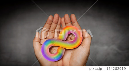 World Autism Day Concepts. represent by Hand Holding a Rainbow Infinity Symbol. Autism Awareness Day. Neurodiversity, Inclusivity, and Acceptance. 124282919