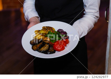 Grilled baked vegetables in a white plate in the 124282977