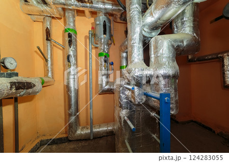 Technical pipes for sewerage in the basement of a 124283055