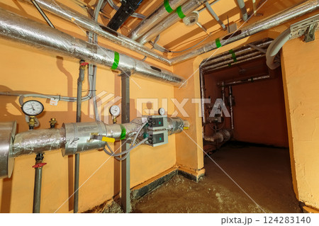Technical pipes for sewerage in the basement of a 124283140