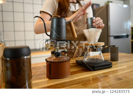 Close up of pour over coffee setup with kettle and dripper in home kitchen 124283573