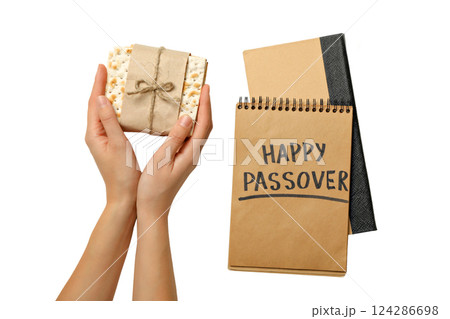 Passover, Matzah held with a festive notebook, isolated on white, PNG Passover, Matzah held with a festive notebook, isolated on white, PNG 124286698