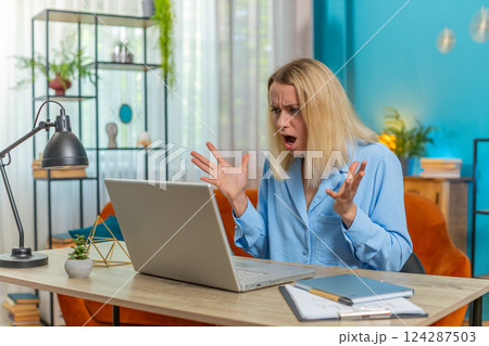 Nervous stressed businesswoman manager quarreling laptop call talk online conflict at home office Nervous stressed businesswoman manager quarreling laptop call talk online conflict at home office 124287503