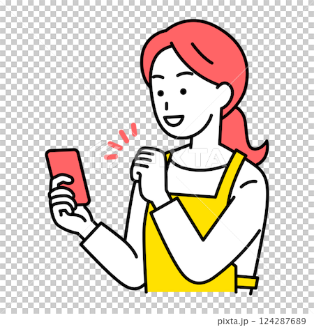 A woman in an apron looking at her smartphone screen and giving a fist pump in delight 124287689